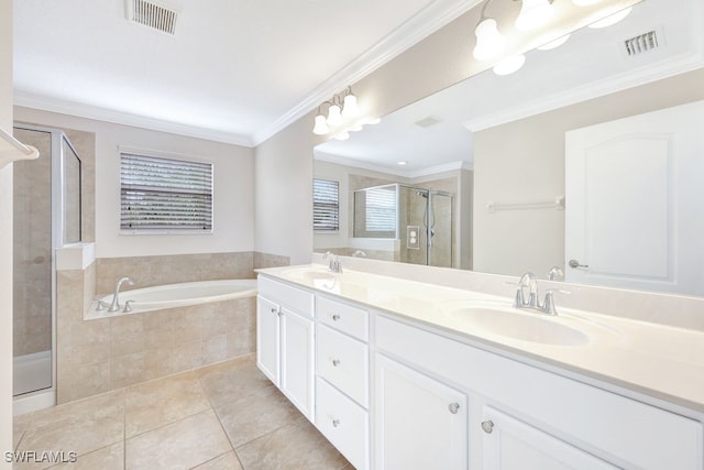 bathroom with dual vanity, ornamental molding, tile patterned floors, and separate shower and tub