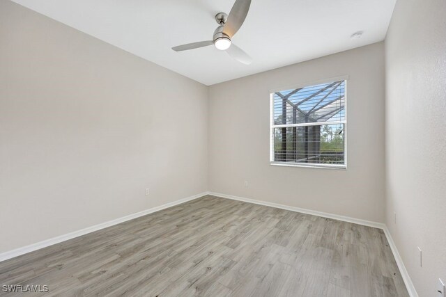 unfurnished room featuring hardwood / wood-style floors and ceiling fan