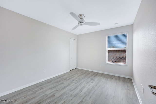 unfurnished room featuring ceiling fan and hardwood / wood-style floors