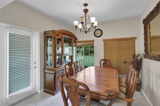 dining room featuring light tile patterned floors and a chandelier