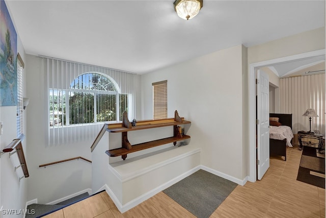 stairway with tile patterned flooring