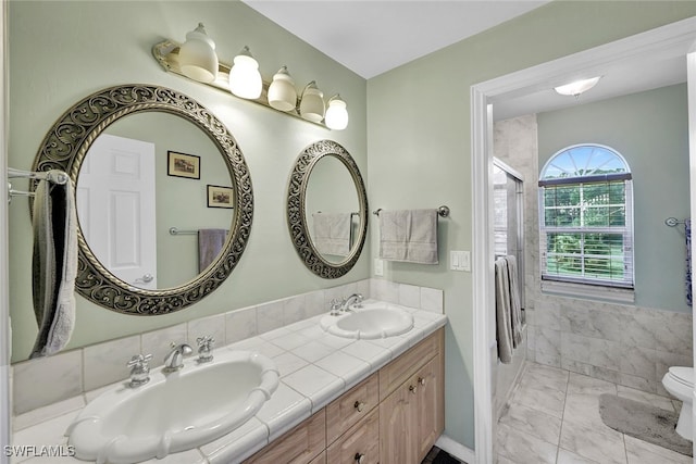 bathroom with double sink vanity, tile patterned floors, and toilet