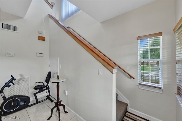 staircase with tile patterned floors