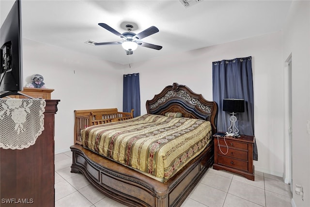 bedroom featuring light tile patterned floors and ceiling fan