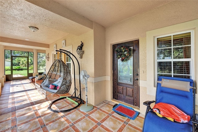 entrance to property with stucco siding