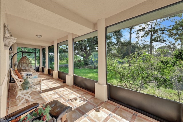 sunroom / solarium featuring a wealth of natural light