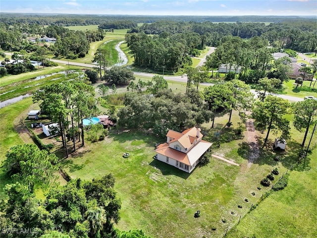 bird's eye view featuring a forest view