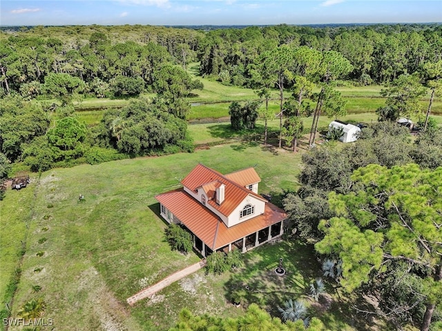 drone / aerial view with a view of trees