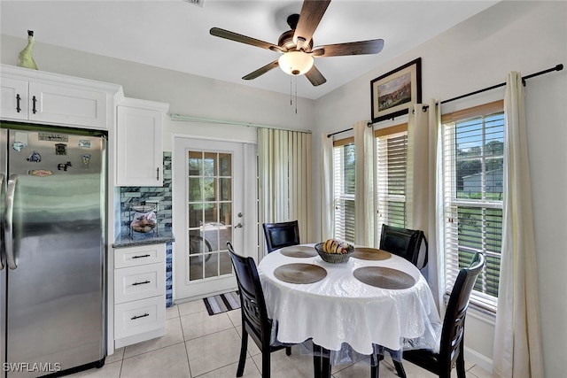 dining area with ceiling fan and light tile patterned flooring