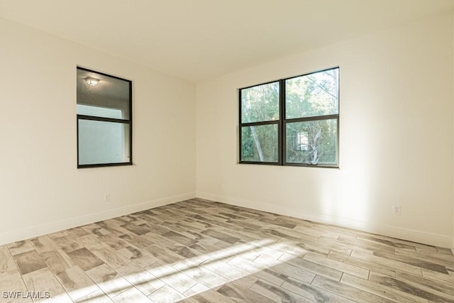 spare room featuring light hardwood / wood-style floors