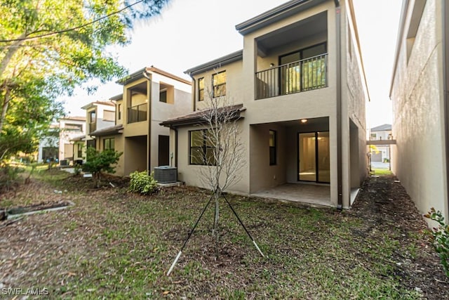 back of property featuring a patio