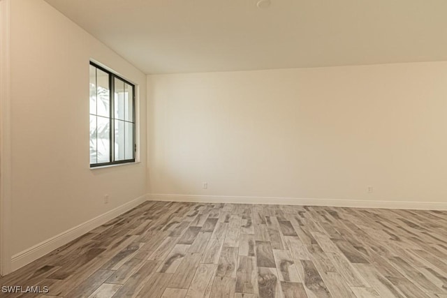 unfurnished room featuring light hardwood / wood-style flooring