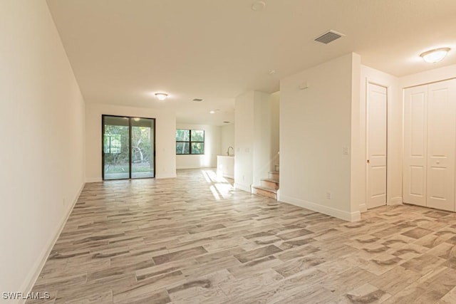 unfurnished living room featuring light hardwood / wood-style flooring