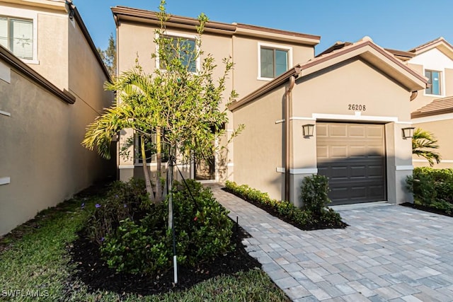 view of front of property with a garage