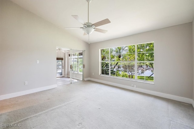 empty room with ceiling fan, carpet, and lofted ceiling