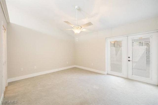 19666 Lost Creek Dr, Estero, FL 33967 - spare room with french doors, light carpet, baseboards, and ceiling fan