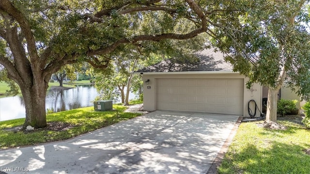 garage featuring central air condition unit and a water view