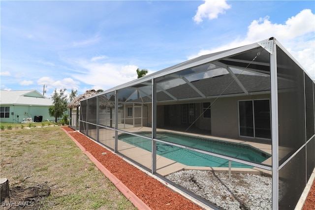 view of pool featuring a patio and a lanai