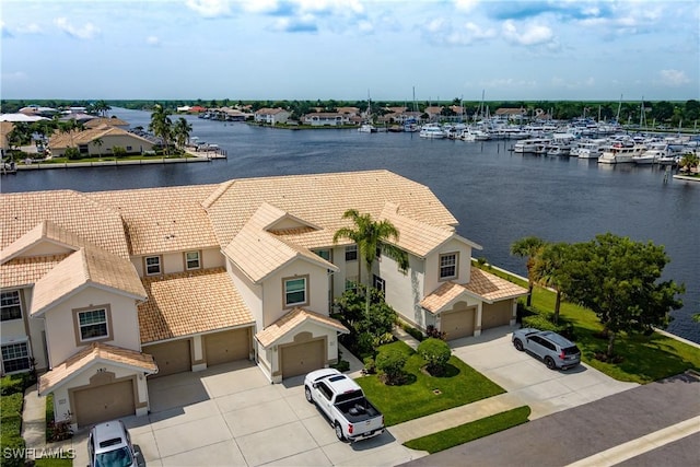 birds eye view of property featuring a water view