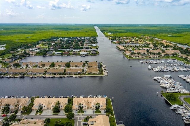 bird's eye view with a water view and a residential view