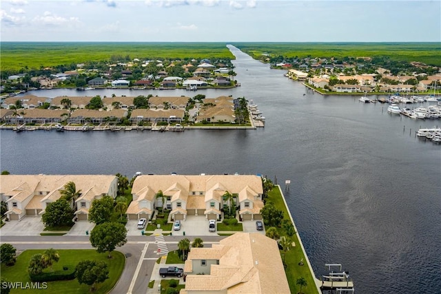 bird's eye view featuring a water view and a residential view