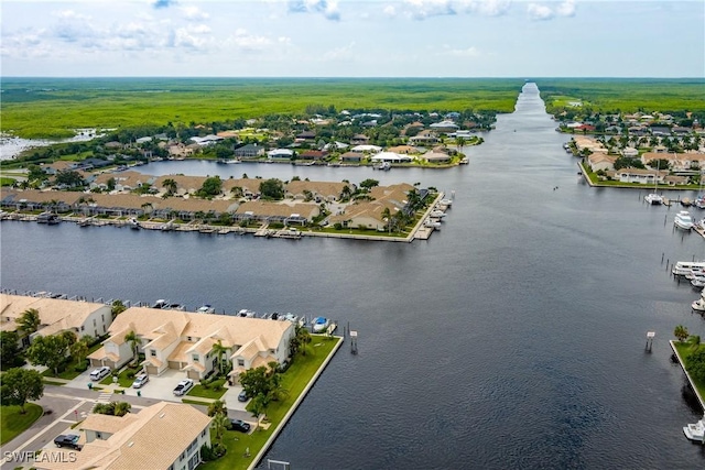 birds eye view of property featuring a residential view and a water view