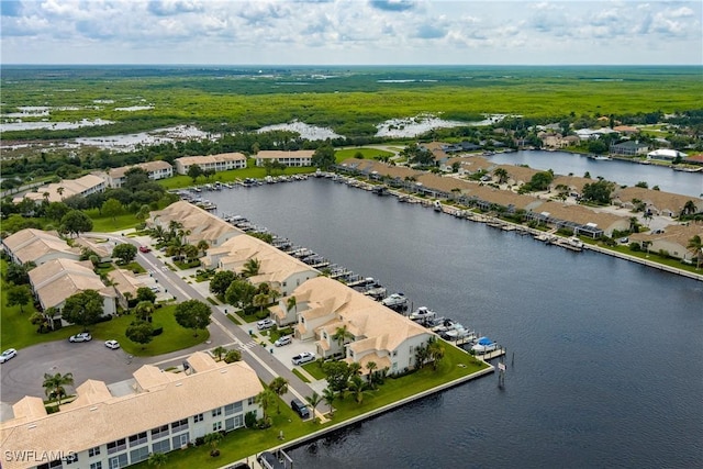 aerial view with a water view and a residential view