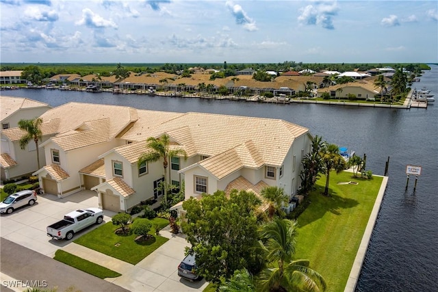 aerial view with a residential view and a water view