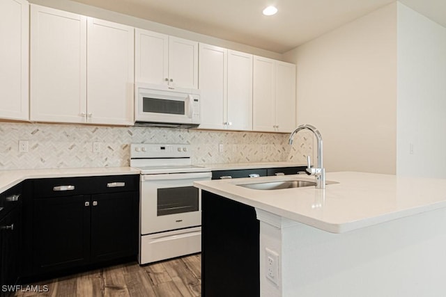 kitchen featuring white cabinets, light wood-type flooring, white appliances, and sink