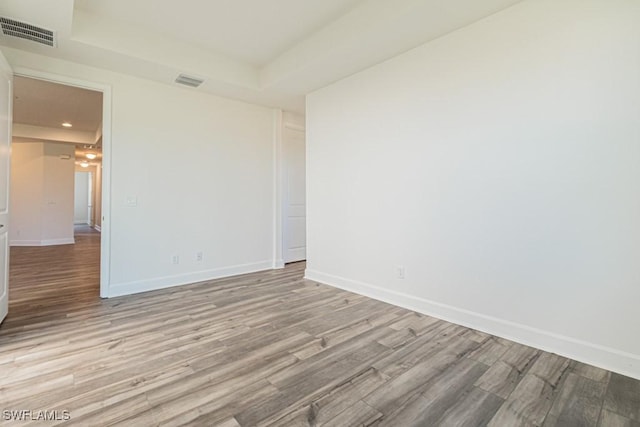 empty room with light hardwood / wood-style floors