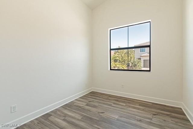 empty room with wood-type flooring