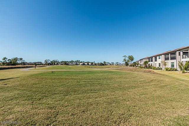 view of property's community featuring a lawn