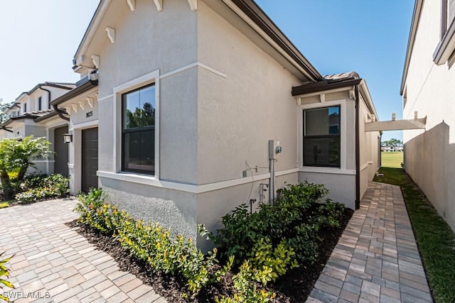 view of property exterior with a garage