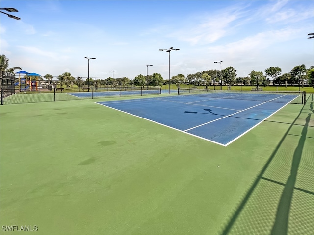 view of sport court featuring a playground