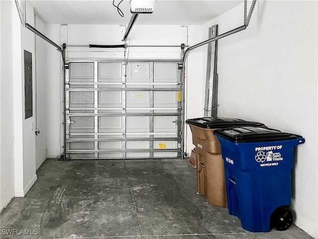 garage with electric panel and a garage door opener