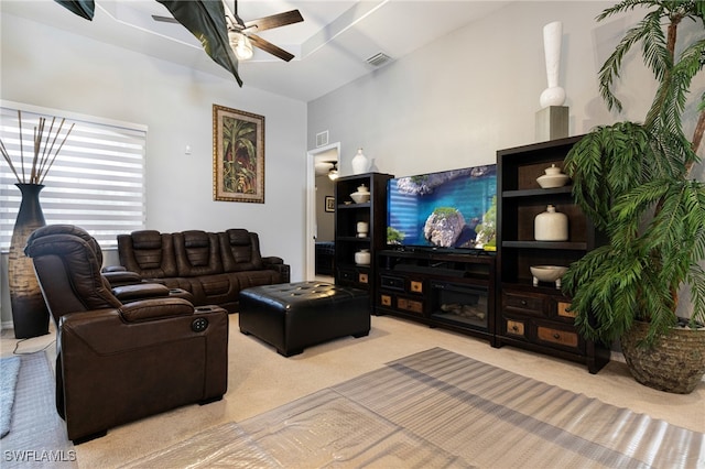 carpeted living room with ceiling fan