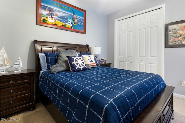 bedroom featuring light carpet and a closet