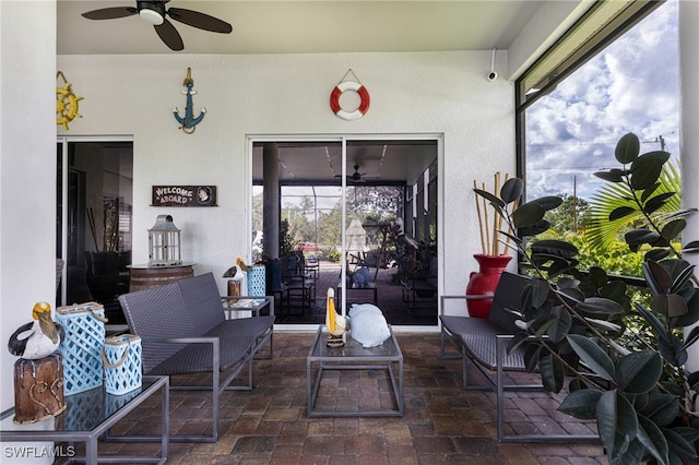 view of patio / terrace with an outdoor living space and ceiling fan