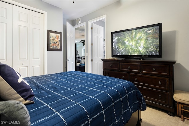 carpeted bedroom featuring a closet