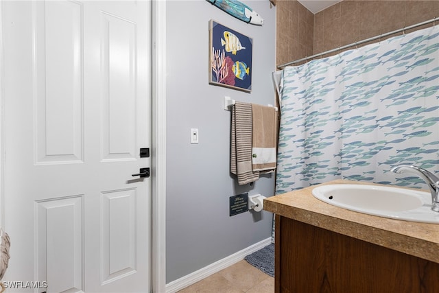 bathroom with vanity, tile patterned flooring, and curtained shower