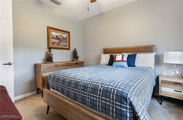 bedroom featuring ceiling fan and carpet