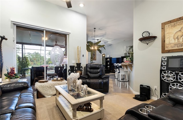 carpeted living room featuring ceiling fan