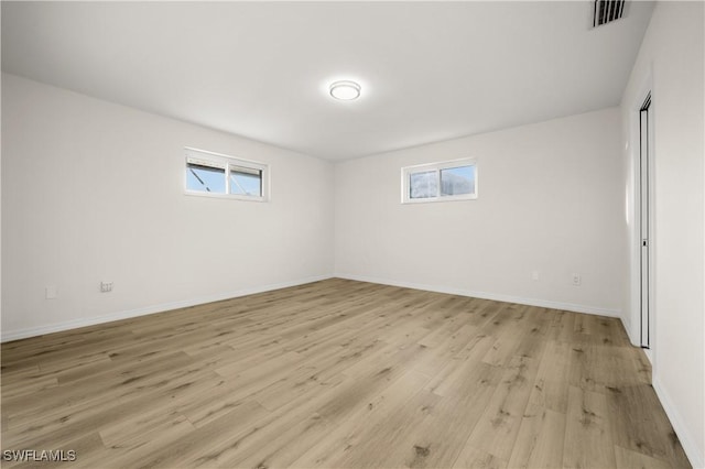 1628 SW 11th Ave, Cape Coral, FL 33991 - empty room featuring light wood-type flooring and baseboards