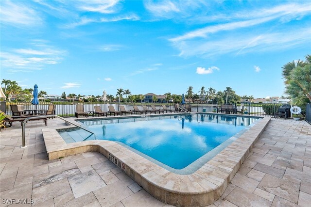 view of swimming pool featuring a patio