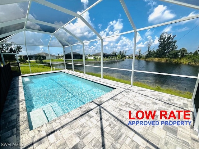 view of swimming pool featuring glass enclosure, a patio area, and a water view