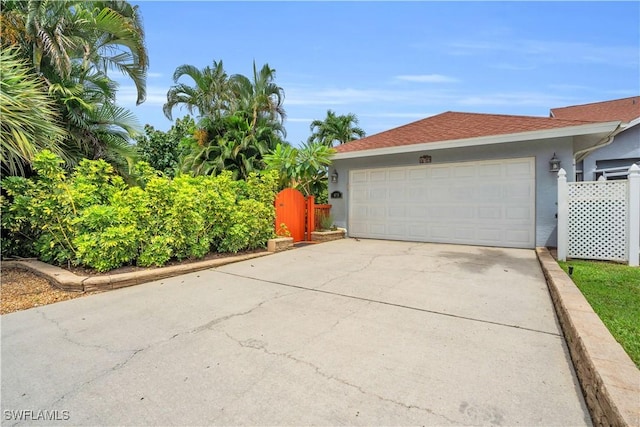 479 Saint Andrews Blvd Unit 135-0, Naples, FL 34113 - garage featuring driveway