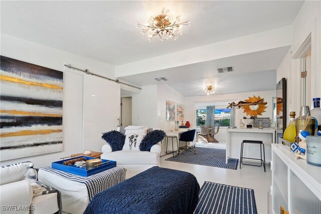 living room featuring a chandelier and concrete flooring