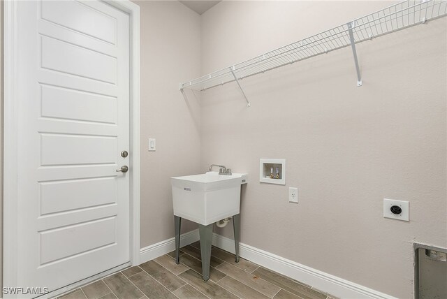 laundry room featuring hookup for an electric dryer, washer hookup, and hardwood / wood-style floors