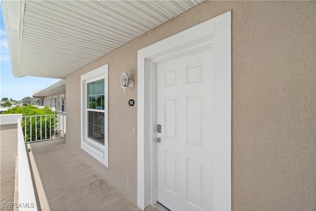 property entrance with a balcony