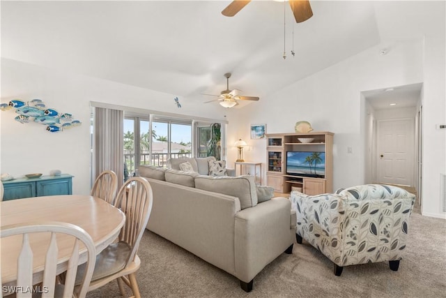 living room featuring light carpet, ceiling fan, and lofted ceiling